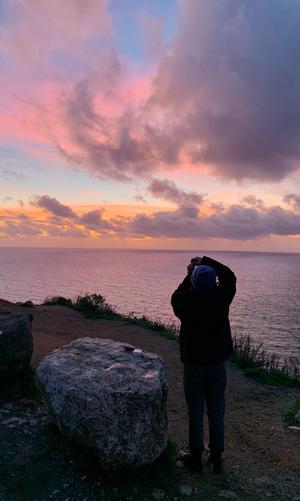 Me taking a picture at the sunset by a beach in LA